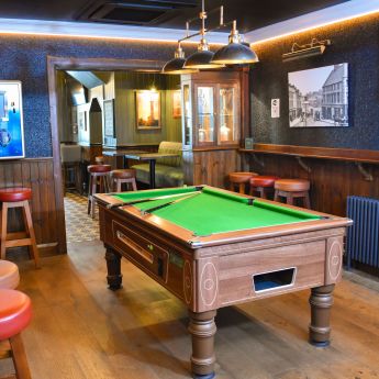 Enjoy a game of pool or darts with friends and family